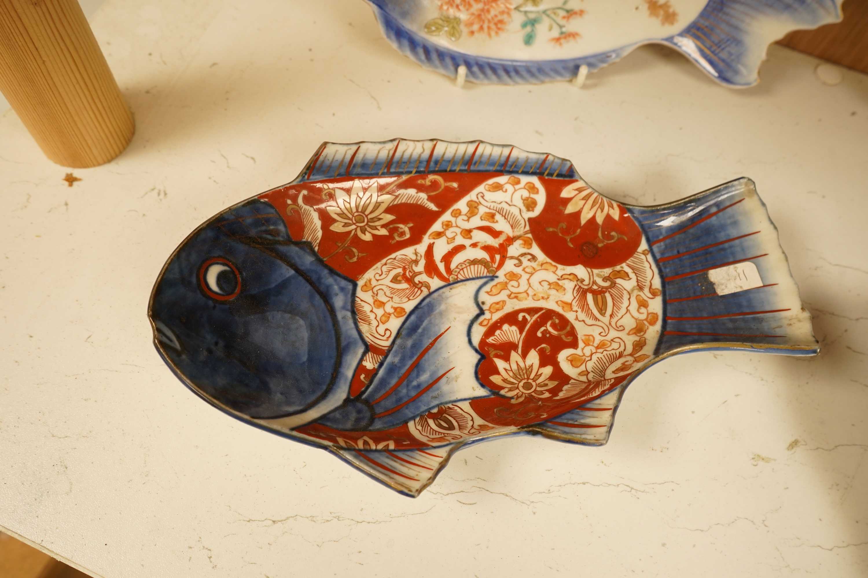 Four Japanese Imari fish-shaped dishes, largest 32cm wide